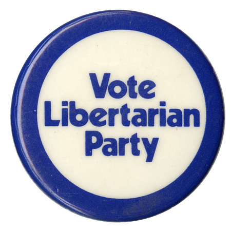 Round, white and blue button with blue text reading "Vote Libertarian Party"
