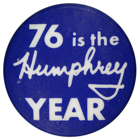 Round, blue button with white text reading "76 is the Humphrey YEAR"