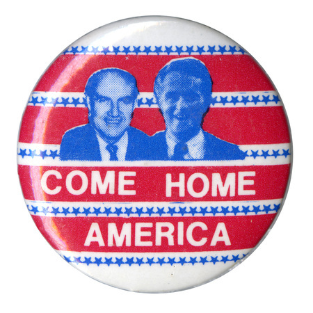 Round, red and white striped button with blue stars and blue portraits of George McGovern and Sargent Shriver. White text reads "COME HOME AMERICA"