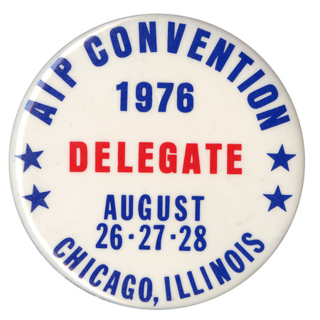 Round, white button with blue and red text reading "AIP CONVENTION 1976 DELEGATE AUGUST 26-27-28 CHICAGO, ILLINOIS"
