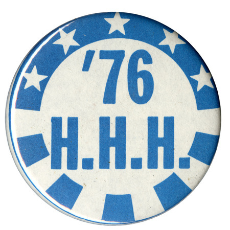 Round, white and blue button with stars and stripes decorations. Blue text reads "'76 H.H.H."