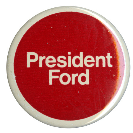 Round, red button with a white border and white text reading "President Ford"