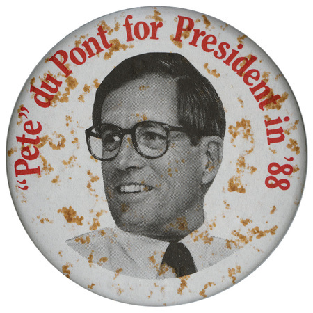 Round, white button with a black and white photograph of Pete du Pont. Red text reads ""Pete" du Pont for President in '88"