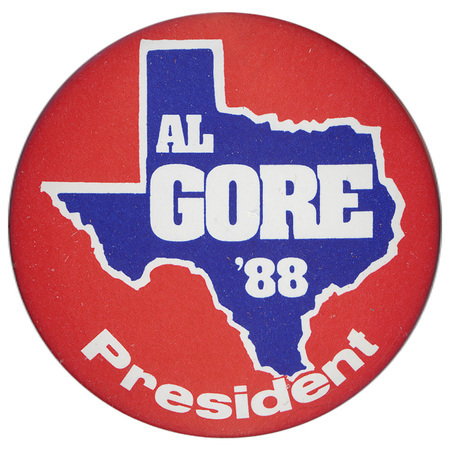 Round, red button with a blue and white outline of the state of Texas. White text reads "AL GORE '88 President"