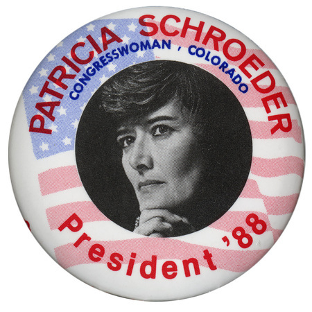 Round button with a background of a US flag and a black and white photograph of Pat Schroeder in the center. Red and blue text reads "PATRICIA SCHROEDER CONGRESSWOMAN COLORADO President '88"