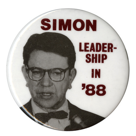 Round, white button with a black and white photograph of Paul Simon and black text reading "SIMON LEADERSHIP IN '88"
