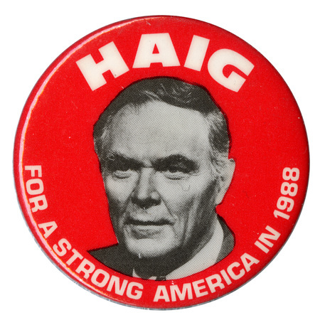 Round, red button with a black and white photograph of Alexander Haig and white text reading "HAIG FOR A STRONG AMERICA IN 1988"
