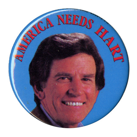 Round, blue button with a color photograph of Gary Hart and red text reading "AMERICA NEEDS HART"