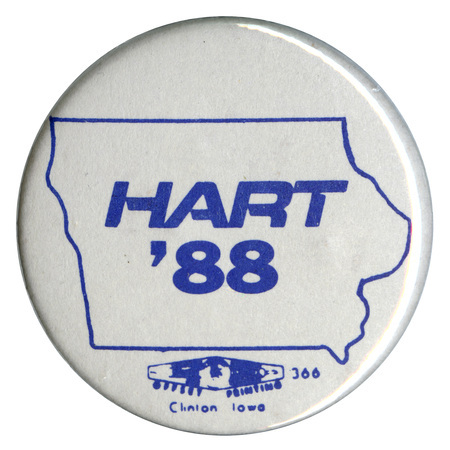 Round, white button with a blue outline of the state of Iowa and blue text reading "HART '88"