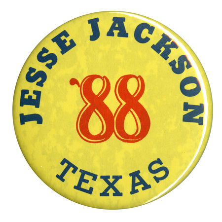 Round, yellow button with black and red text reading "JESSE JACKSON '88 TEXAS"
