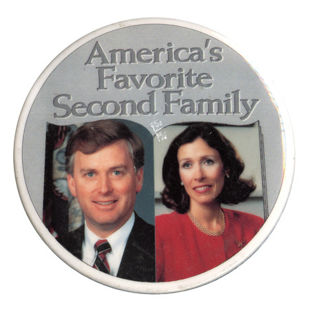 Round, gray button with color photographs of Dan and Marilyn Quayle. Darker gray text reads "America's Favorite Second Family"
