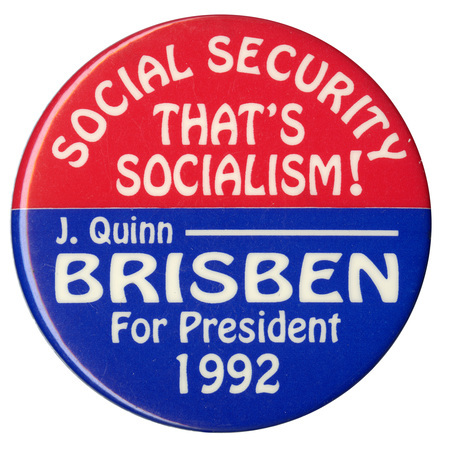 Round, red and blue button with white text reading "SOCIAL SECURITY THAT'S SOCIALISM! J. Quinn BRISBEN For President 1992"