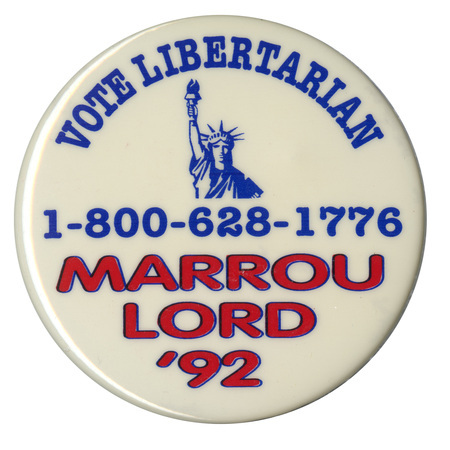 Round, white button with a blue drawing of the Statue of Liberty. Blue and red text reads "VOTE LIBERTARIAN 1-800-628-1776 MARROU LORD '92"