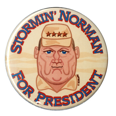 Round button with a color caricature drawing of Norman Schwarzkopf. Blue text reads "STORMIN' NORMAN FOR PRESIDENT"