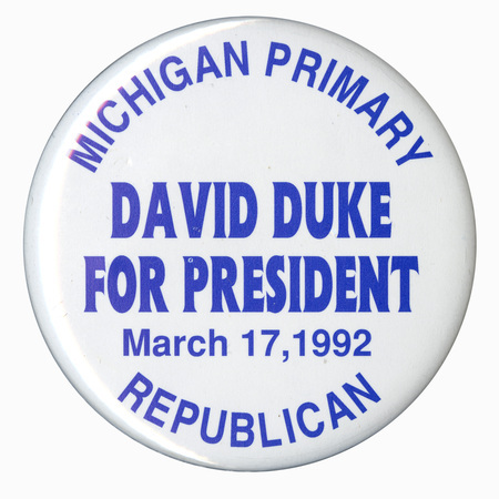 Round, white button with blue text reading "MICHIGAN PRIMARY DAVID DUKE FOR PRESIDENT March 17, 1992 REPUBLICAN"