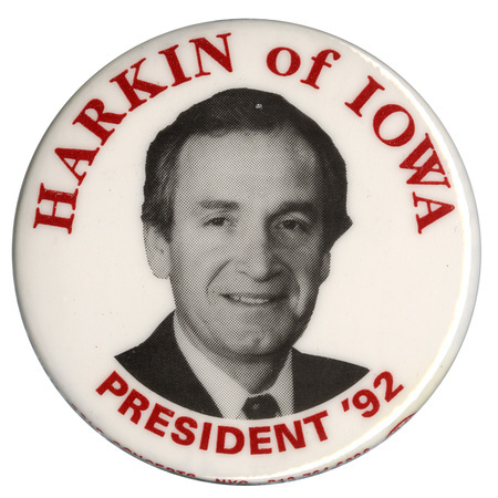 Round, white button with a black and white photograph of Tom Harkin. Red text reads "HARKIN of IOWA PRESIDENT '92"