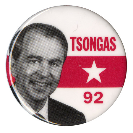 Round, white button with a band of red in the middle containing a white star. A black and white photograph of Paul Tsongas appears next to red text reading "TSONGAS 92"