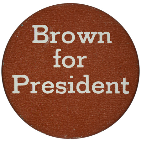 Round, brown button with white text reading "Brown for President"
