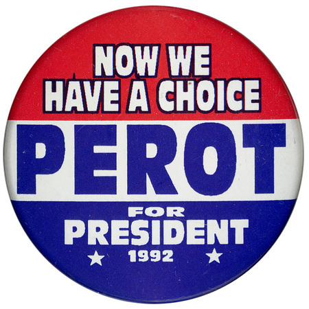 Round button with horizontal bands of red, white, and blue. White and blue text reads "NOW WE HAVE A CHOICE PEROT FOR PRESIDENT 1992"