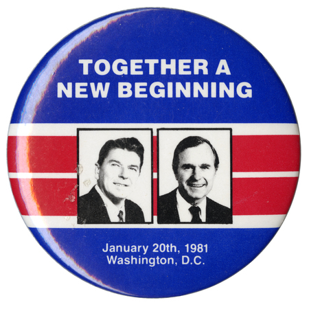 Round, blue button with black and white photographs of Ronald Reagan and George H. W. Bush against bands of red and white. White text reads "TOGETHER A NEW BEGINNING January 20th, 1981 Washington, D.C."