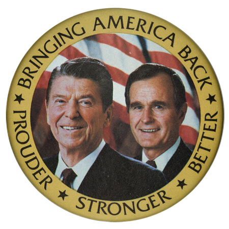 Round button bordered in beige with a color photograph of Ronald Reagan and George H. W. Bush in the center. Black text around the edge reads "BRINGING AMERICA BACK PROUDER STRONGER BETTER"