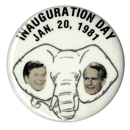 Round, white button with photographs of Ronald Reagan and George H. W. Bush against a black and white drawing of an elephant's head. Black text reads "INAUGURATION DAY JAN. 20, 1981"
