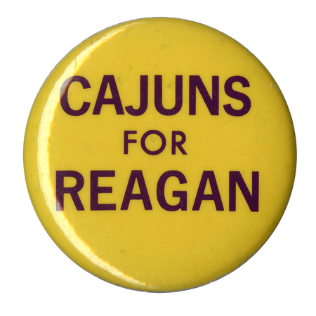 Round, yellow button with black text reading "CAJUNS FOR REAGAN"