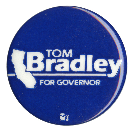 Round, blue button with a white outline of the state of California and white text reading "TOM Bradley FOR GOVERNOR"