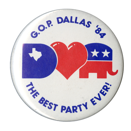 Round, white button with blue text reading "G.O.P. DALLAS '84 THE BEST PARTY EVER!" In the center is a large blue "D" with a white outline of the state of Texas, a red heart, and a red and white elephant symbol of the GOP.