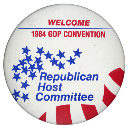 Round, white button with blue stars and red stripes. Red and blue text reads "WELCOME 1984 GOP CONVENTION Republican Host Committee"