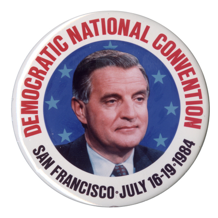 Round button with a white border and a color photograph of Walter Mondale in the center, surrounded by blue stars. Red and black text reads "DEMOCRATIC NATIONAL CONVENTION SAN FRANCISCO JULY 16-19 1984"