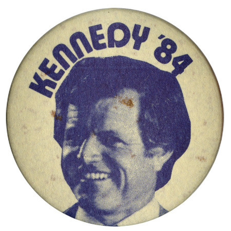 Round, white button with a black and white photograph of Ted Kennedy and black text reading "KENNEDY '84"