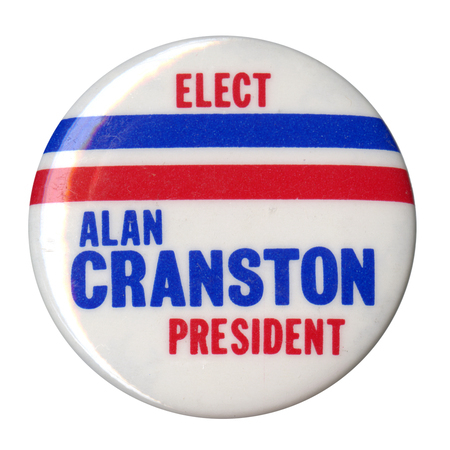 Round, white button with red and blue stripes. Red and blue text reads "ELECT ALAN CRANSTON PRESIDENT"
