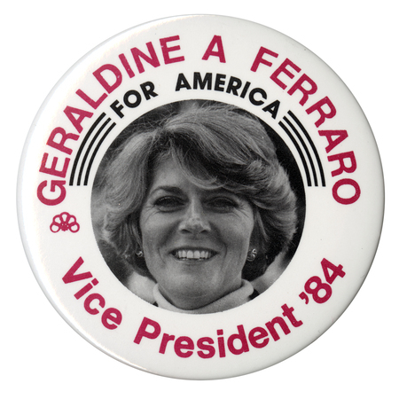 Round, white button with a black and white photograph of Geraldine Ferraro in the center. Red and black text reads "GERALDINE A FERRARO FOR AMERICA Vice President '84"