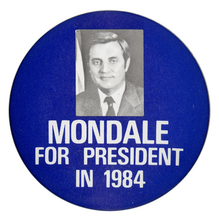 Round, blue button with a black and white photograph of Walter Mondale. White text reads "MONDALE FOR PRESIDENT IN 1984"