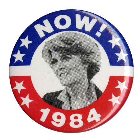 Round button with a blue and red border and a black and white photograph of Geraldine Ferraro. White text reads "NOW! 1984"