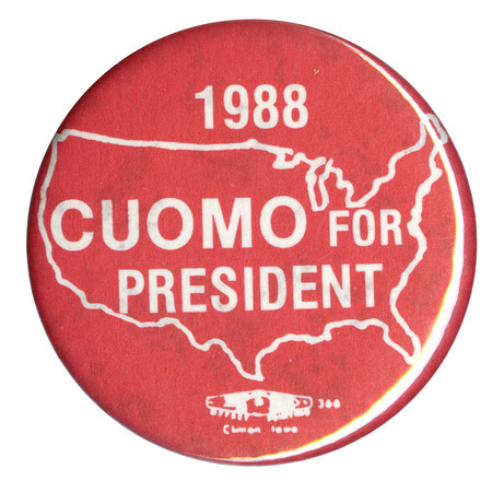 Round, red button with a white outline of the United States. White text reads "1988 CUOMO FOR PRESIDENT"