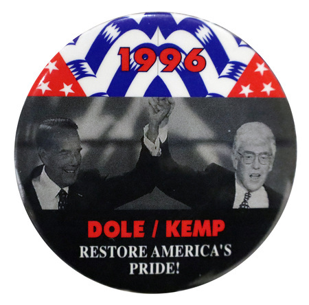 Round button with sections of red, white, and blue; black; and a black and white photograph of Bob Dole and Jack Kemp. Red and white text reads "1996 DOLE/KEMP RESTORE AMERICA'S PRIDE!"