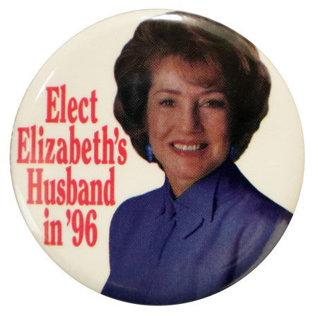 Round, white button with a color photograph of Elizabeth Dole. Red text reads "Elect Elizabeth's Husband in '96"