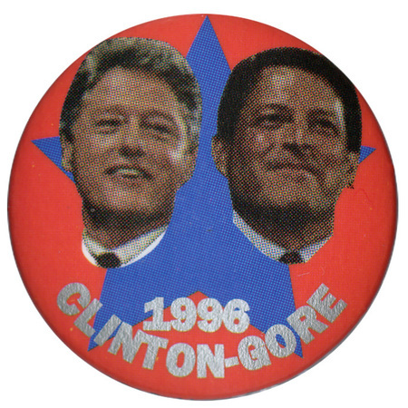Round, red button with a large blue star and color photographs of Bill Clinton and Al Gore. Gray text reads "1996 CLINTON-GORE"