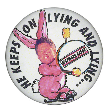 Round, white button with a color illustration of the Energizer bunny with a color photograph of Bill Clinton's face where the bunny's face should be. Black text on the bunny's drum reads "EVERLIAR". Black text around the edge of the button reads "HE KEEPS ON LYING AND LYING..."