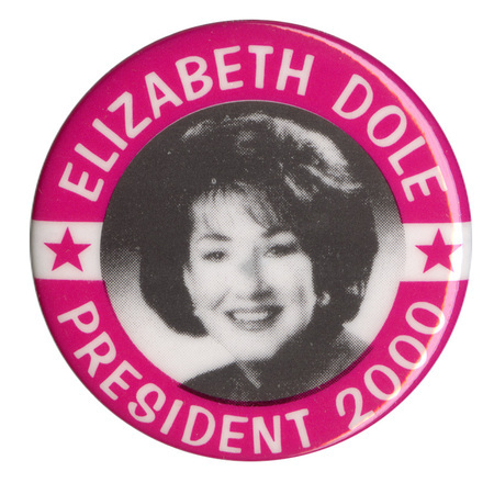 Round button with a red border. In the center is a black and white photograph of Elizabeth Dole. White text reads "ELIZABETH DOLE PRESIDENT 2000"