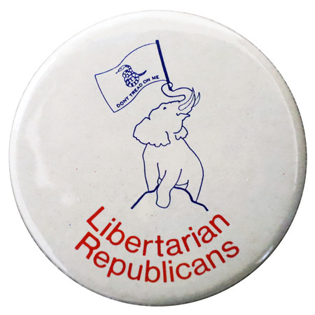 Round, white button with a blue line drawing of an elephant summiting a hill and carrying in its trunk the Gadsden flag bearing a coiled snake and text reading "DON'T TREAD ON ME". Red text below reads "Libertarian Republicans"
