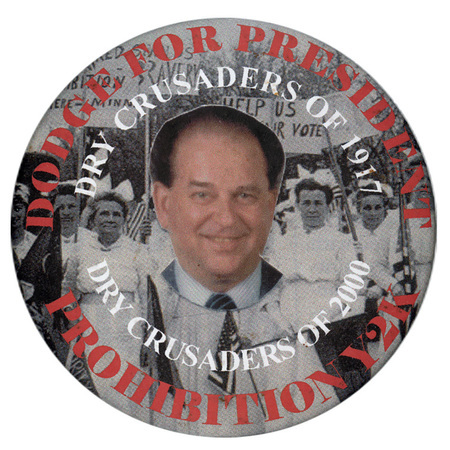 Round button with a color photograph of Earl F. Dodge against a black and white photograph of a group marchers wearing white. White and red text reads "DODGE FOR PRESIDENT DRY CRUSADERS OF 1917 DRY CRUSADERS OF 2000 PROHIBITION Y2K"