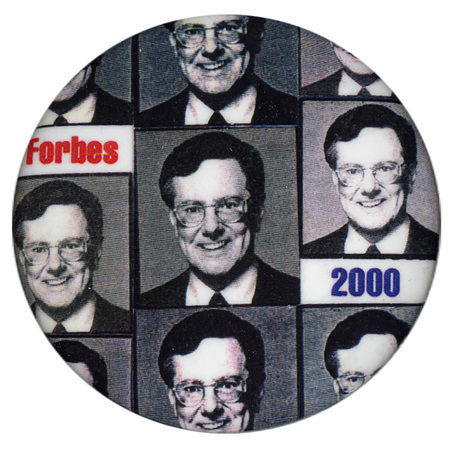 Round button with a repeated pattern of black and white photographs of Steve Forbes. Red and blue text reads "Forbes 2000"