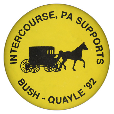 Round, yellow button with a black silhouette of a horse-drawn buggy. Black text reads "INTERCOURSE, PA SUPPORTS BUSH-QUAYLE '92"