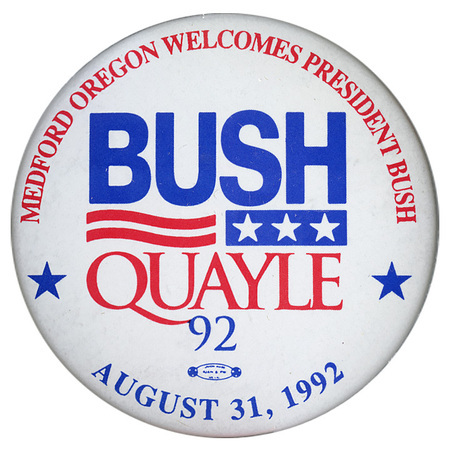 Round, white button with blue and red text reading "MEDFORD OREGON WELCOMES PRESIDENT BUSH BUSH QUAYLE 92 AUGUST 31, 1992"