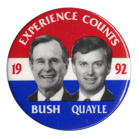 Round button with red, white, and blue horizontal bands. Black and white photographs of George H. W. Bush and Dan Quayle are in the center. White and red text reads "EXPERIENCE COUNTS 1992 BUSH QUAYLE"