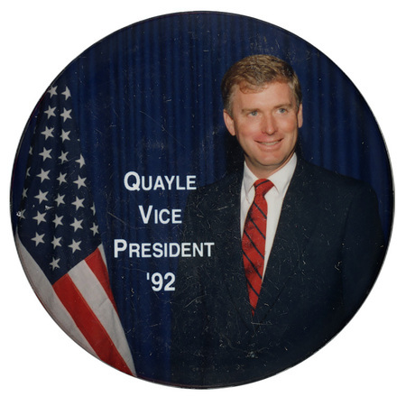Round button with a color photograph of Dan Quayle standing next to a US flag. White text reads "QUAYLE VICE PRESIDENT '92"