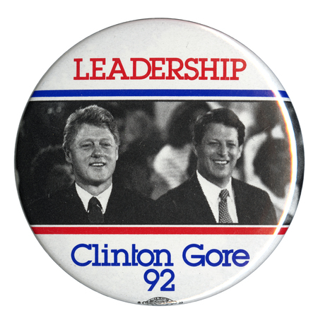 Round, white button with a black and white photograph of Bill Clinton and Al Gore across the middle. Red and blue text reads "LEADERSHIP Clinton Gore 92"